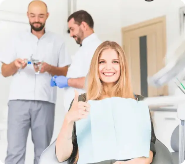 A woman smiling showing her perfect teeth in a dental clinic